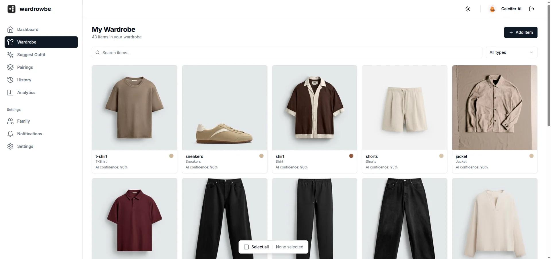Wardrowbe digital wardrobe grid view with AI-tagged clothing items